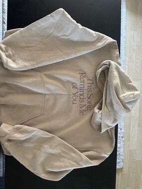 LONELY GHOST Beige Hoodie with Purple Text "This Song Reminds Me of You"